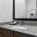 a bathroom with a marble countertop