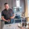 a kitchen with a bar stool and a table