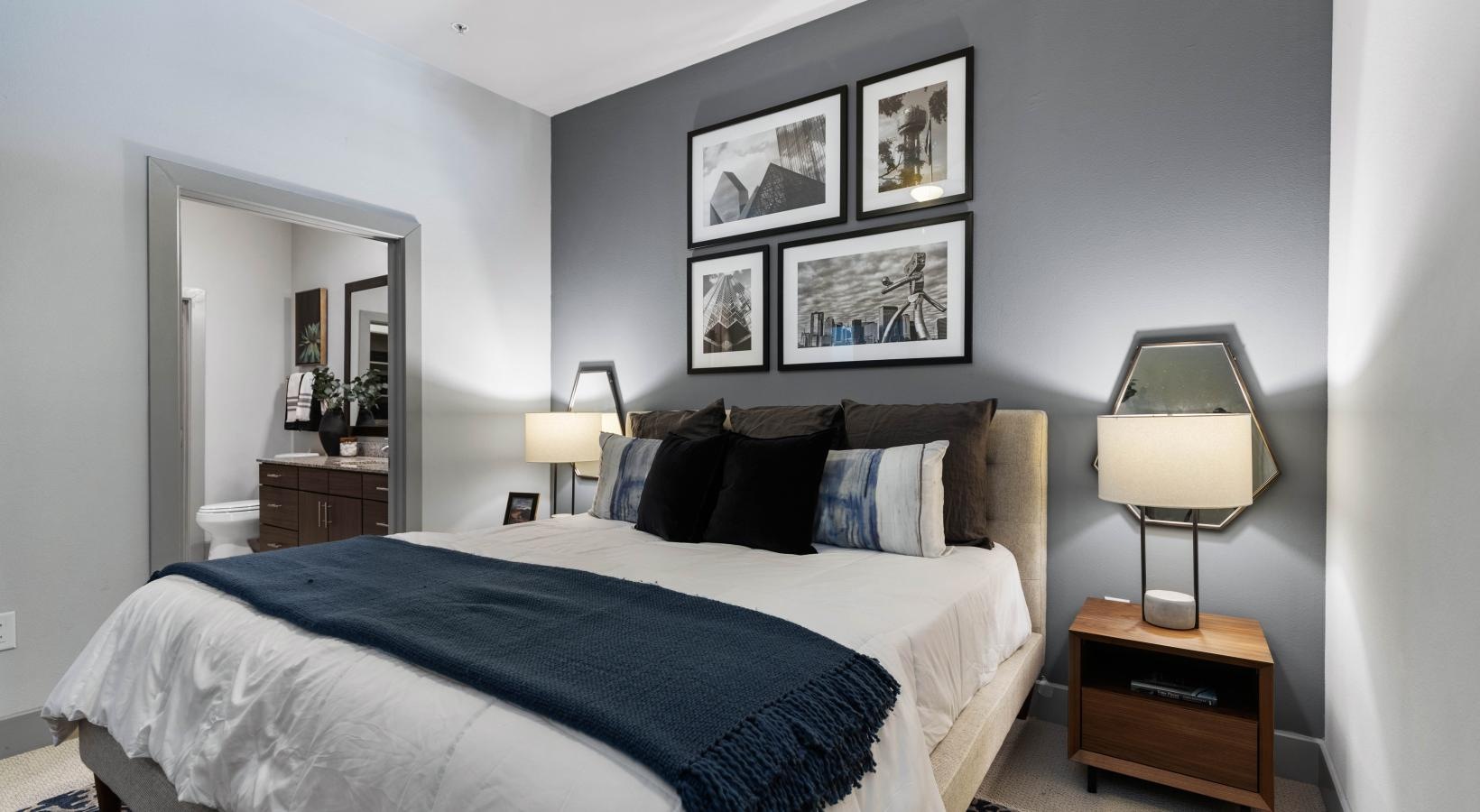 Beautiful bedrooms to fit every need a bedroom with a bed and lamps