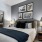a bedroom with a bed and lamps