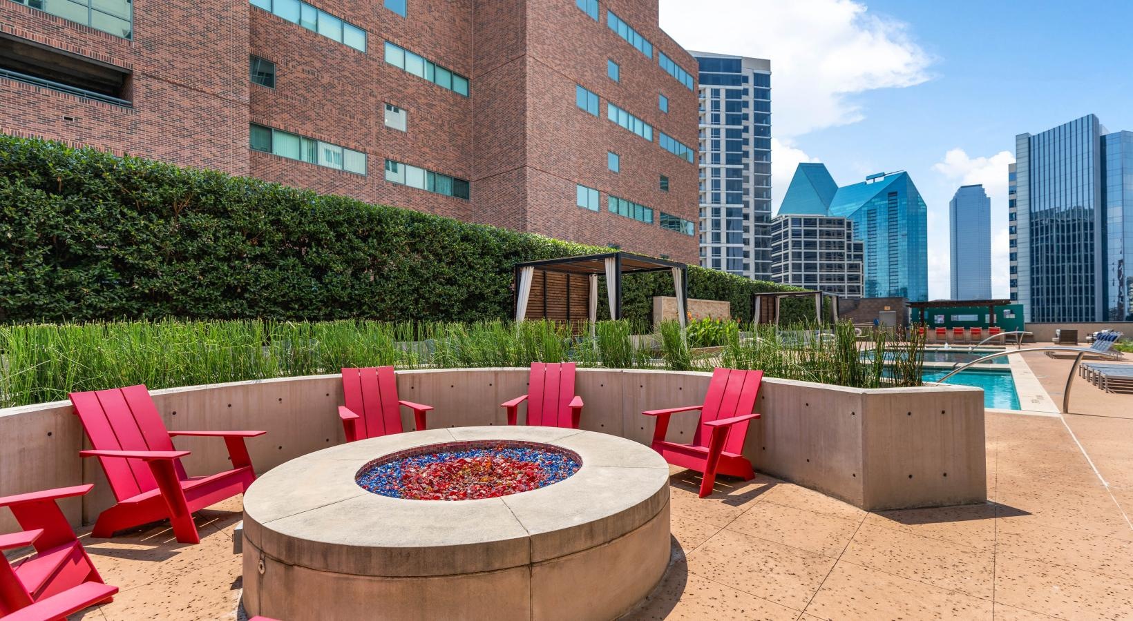 Relax and unwind poolside red chairs in a pool