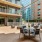 a courtyard with tables and chairs