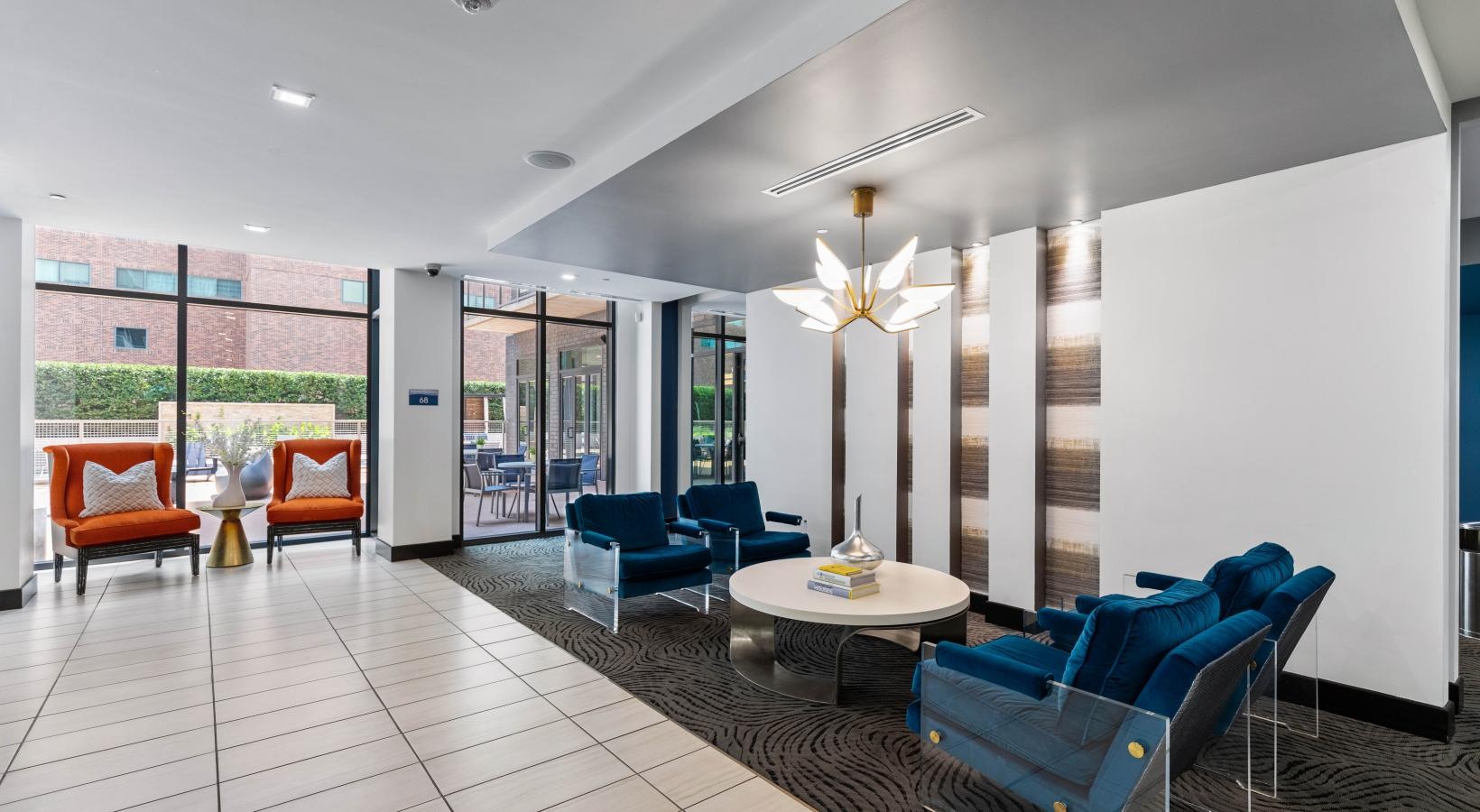 A perfect fit for the whole family a room with a table chairs and a chandelier