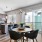 a kitchen with a dining table and chairs